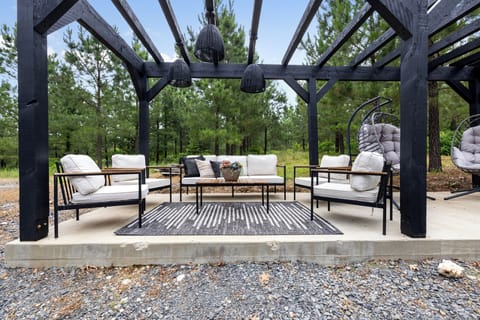 Outdoor Oasis: Relax in stylish seating surrounded by nature's beauty and fresh air.