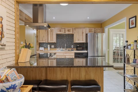 Barstool seating near the kitchen.