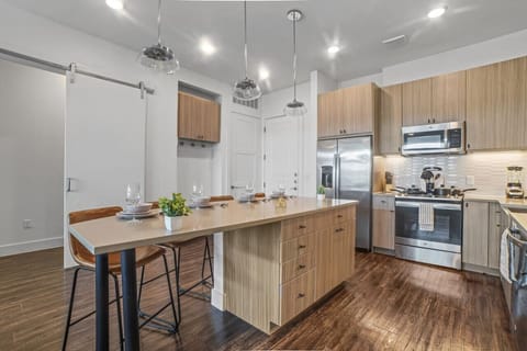 The dining room is bathed in natural light, creating a bright and inviting space where every meal feels special.