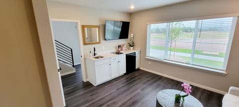 Ground level suite living room 60" TV