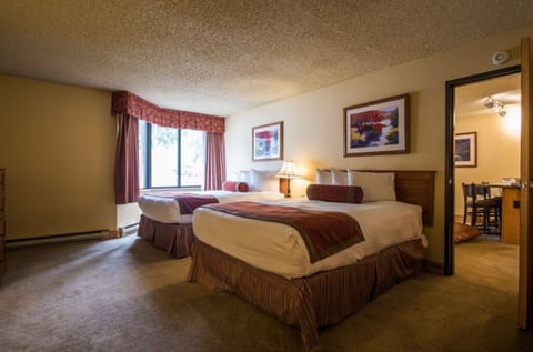 Spacious bedroom with a cozy atmosphere and scenic views for a relaxing stay.