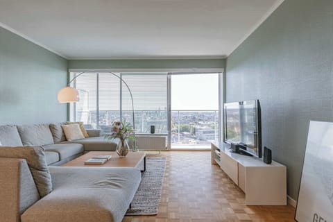 Bright living area with access to terrace and city view