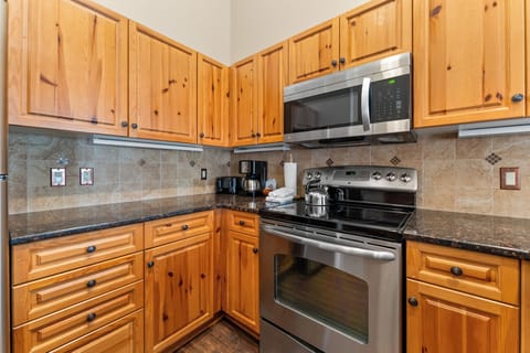 Kitchen with granite countertops and stainless steel appliances