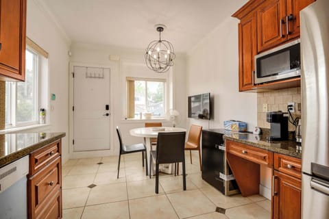Well-appointed kitchen with wooden cabinetry, granite countertops, and modern appliances, ready for your culinary adventures.