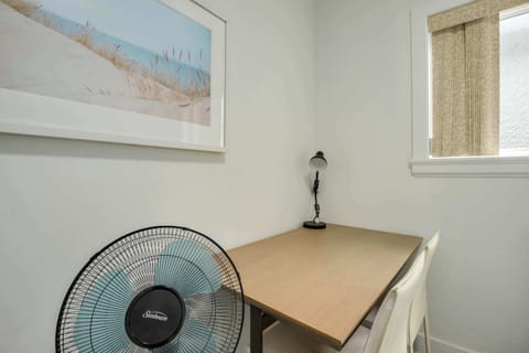 Dedicated workspace in a quiet corner, complete with a desk and lamp, ideal for productivity during your visit.