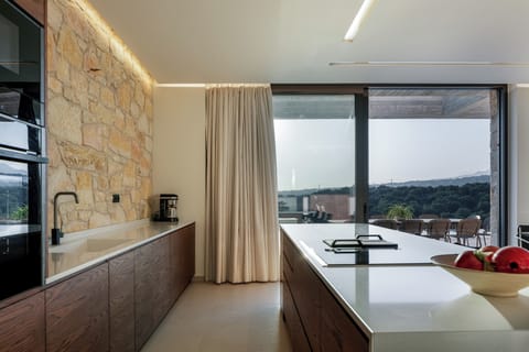 The fully equipped kitchen features top-of-the-line appliances, perfect for a self-catered holiday