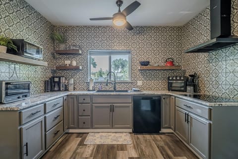 A thoughtfully designed kitchen with ample counter space, perfect for preparing meals and making memories.