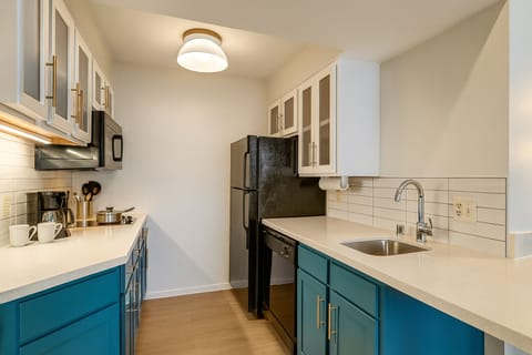Cook with ease in a sleek kitchen with modern appliances.