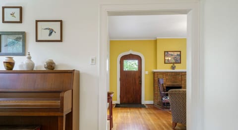 Embrace the moment in the dining room that includes a dining table and piano!