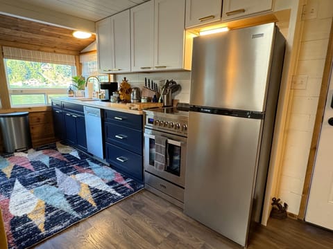 Full kitchen with views of lake/mountains, stainless steel appliances