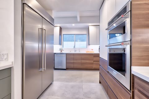 New kitchen- 10' island. KitchenAid gas range, 48" fridge/freezer, 2 D/Ws.