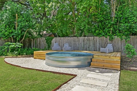 Our cowboy pool offers a refreshing way to cool off whether soaking up the sun or do a polar plunge in the cooler months, making it a perfect spot for swimming and enjoying fun moments outdoors.