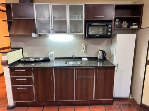 Fridge, microwave, cookware/dishes/utensils