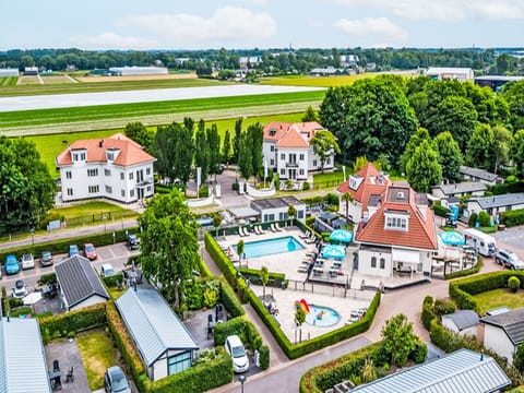 Building, Property, Plant, Sky, House, Land Lot, Urban Design, Cloud, Neighbourhood, Tree