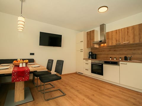 Cabinetry, Furniture, Countertop, Wood, Kitchen Stove, Table, Interior Design, Kitchen, Flooring, Floor