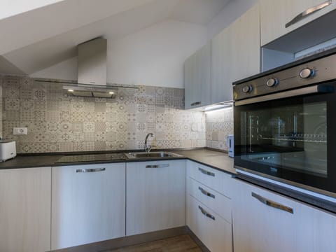 Kitchen, Kitchen Appliance, Countertop, Major Appliance, Cabinetry, Interior Design, Flooring, Kitchen Sink, Kitchen Stove, Home Appliance