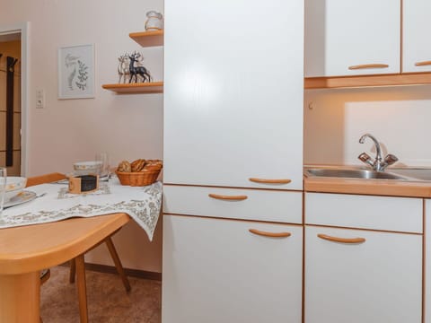 Cabinetry, Furniture, Table, Building, Wood, Interior Design, Countertop, Drawer, Kitchen, Floor