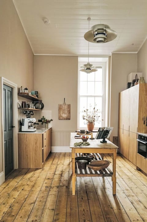 Brown, Table, Wood, Plant, Cabinetry, Houseplant, Interior Design, Flooring, Floor, Living Room