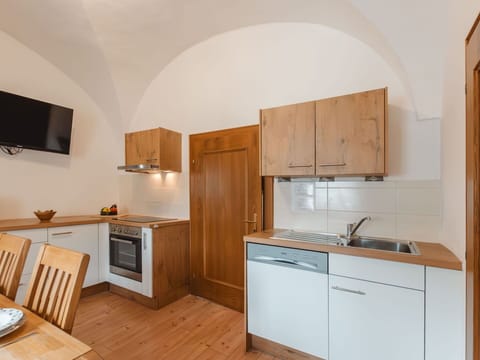 Building, Cabinetry, Countertop, Furniture, Kitchen Appliance, Wood, Kitchen Stove, Kitchen, Interior Design, Floor