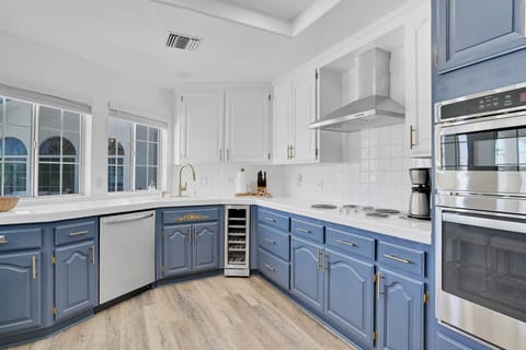 Large kitchen with dishwasher, wine cooler, cook top and double ovens