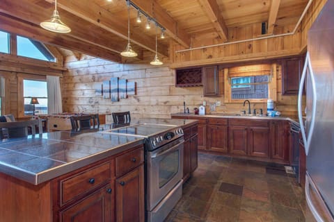 The open kitchen offers ample space & all the comforts of home