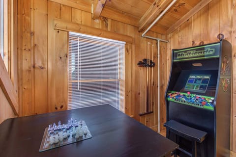 The upper-level loft bedroom is ideal for gaming, with twin bunks & trundle!