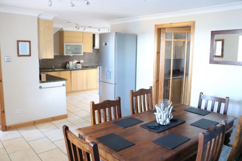 Large kitchen with adjacent dining area