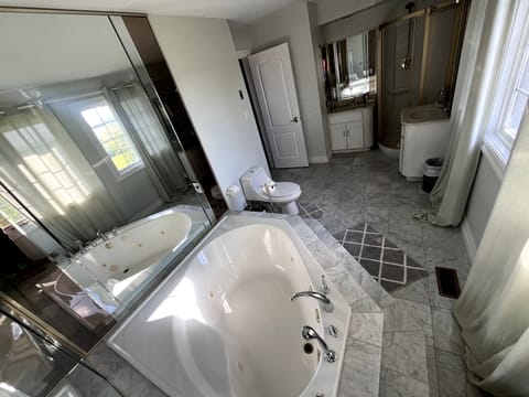 Shower, jetted tub, towels, soap