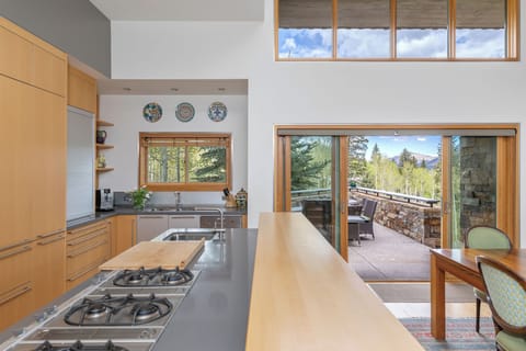 Kitchen opens to dining area, western deck and amazing views