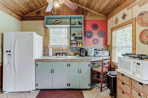 The charming kitchen area offers ample space & all the comforts of home