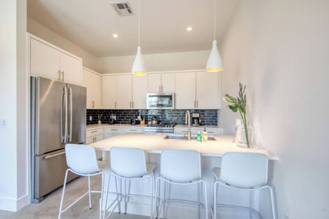 Unit B kitchen with drip coffee maker, toaster, blender, and more