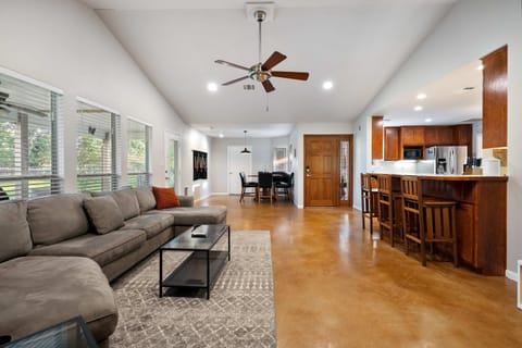 Relax with a movie on the queen sleeper sofa in the main house living room