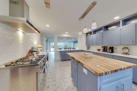 The kitchen is a chef’s dream, offering endless space & top-tier appliances