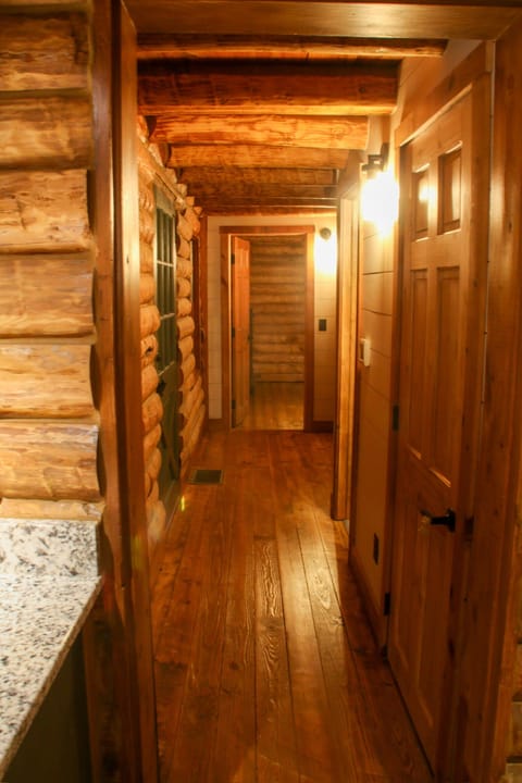 Hallway to powder room, laundry and master suite