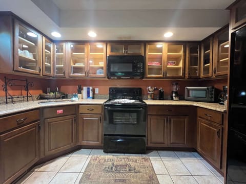 The warm, inviting kitchen offers ample space & every home comfort