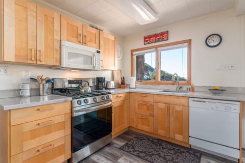 Kitchen with drip coffee maker, kettle, toaster, and more