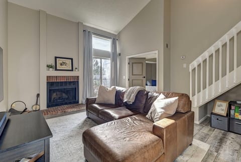 Venetian leather couch, cozy fireplace, and high vaulted ceilings - pure comfort