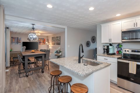 Stylish and functional, with modern appliances including a microwave and dishwasher.