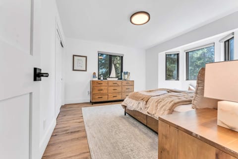 Bedroom 2: Queen bed, large dresser, main floor