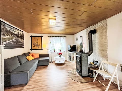 Furniture, Couch, Wood, Flooring, Building, Floor, Picture Frame, Chair, Studio Couch, Laminate Flooring