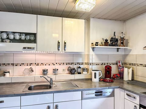 Kitchen Sink, Countertop, Sink, Cabinetry, Tap, Kitchen, Kitchen Stove, Interior Design, Lighting, Stove