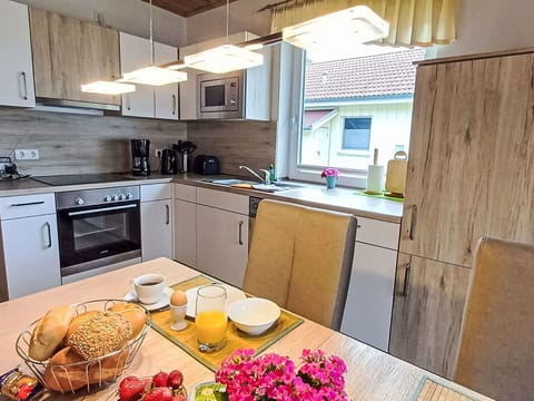 Cabinetry, Countertop, Property, Furniture, Tableware, Food, Kitchen Appliance, Kitchen Stove, Flower, Kitchen