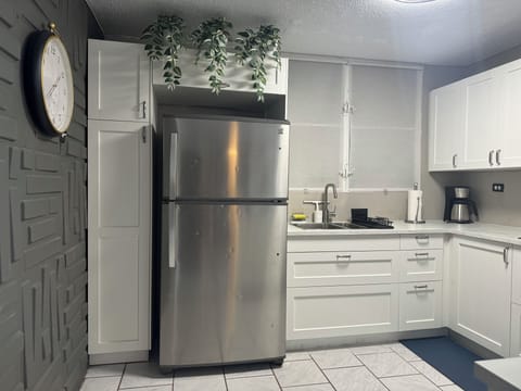 Fridge, microwave, stovetop, coffee/tea maker