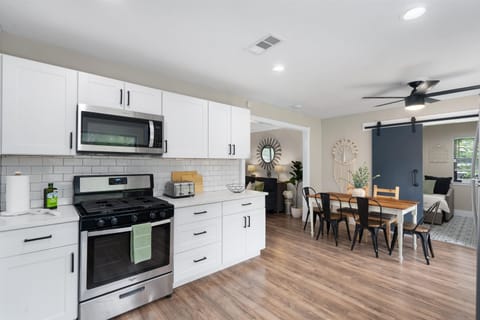 Kitchen - with kitchen/dining table and entrance to laundry