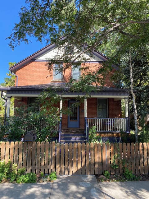 Beautiful yard and fence around home.
Gorgeous back yard with table and chairs.