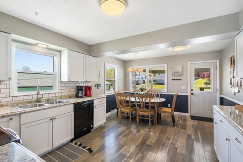 The spacious eat-in kitchen is well equipped with all the comforts of home