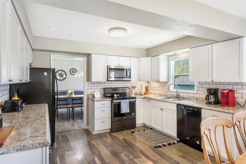 The spacious eat-in kitchen is well equipped with all the comforts of home