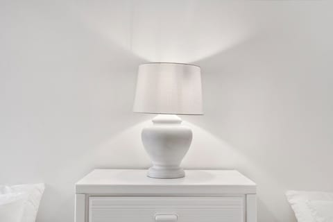 This 1st floor bedroom includes a pair of cozy full-sized beds