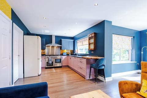This Kitchen is open plan and follows through to a seating area and dining area with a 32 Inch TV