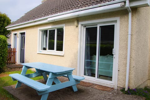 Outside dining area in well maintained garden at Dunmore Villas Holiday Home No 1 - seaside family-friendly holiday home in Dunmore East, Co. Waterford, Ireland